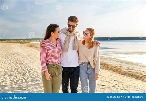 Happy Friends Walking Along Summer Beach Stock Image - Image of concept, summertime: 165134957