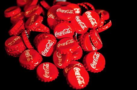 Royalty-Free photo: Pile of red Coca-Cola bottle crowns | PickPik