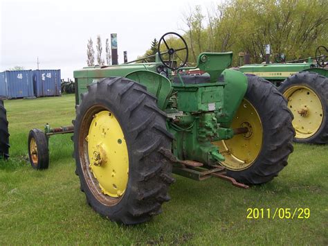 DIFFERENT COLOURED JUNK: John Deere 70 diesel row crop.