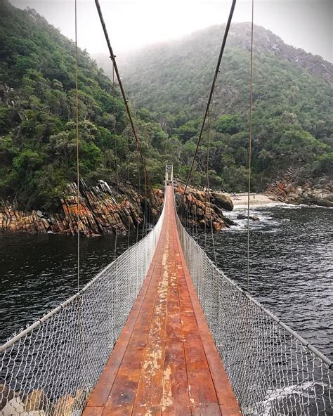 The suspension bridge over the Storms River Mouth of Tsitsikamma on a mist afternoon! Enjoy! # ...