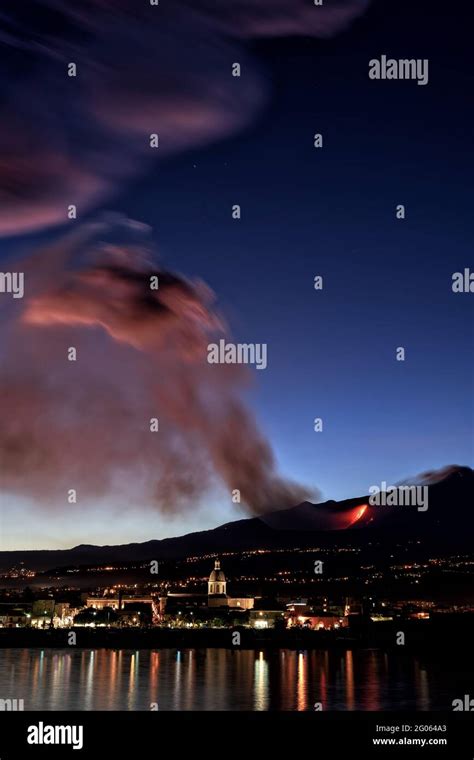 Night eruption of Etna volcano seen from giarre riposto village, Etna ...