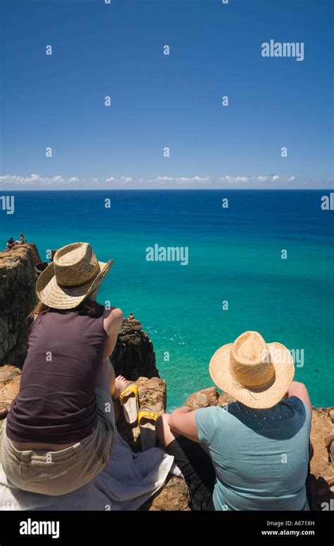 Tourists look out over the Pacific Ocean from Indian Head on Fraser Island Stock Photo - Alamy