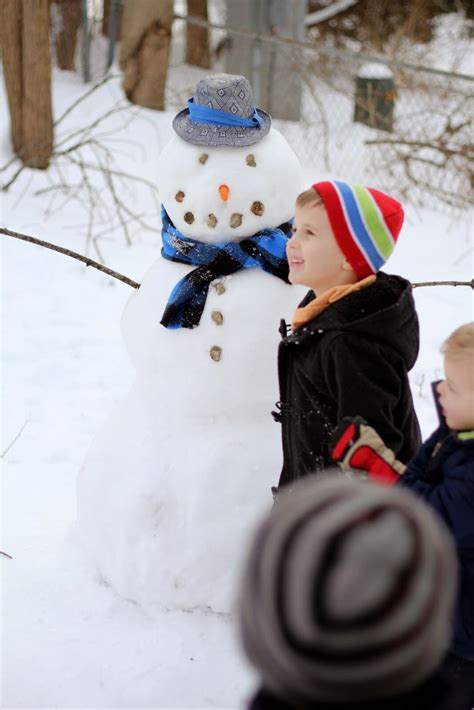 kids with snowman - Raising Roberts