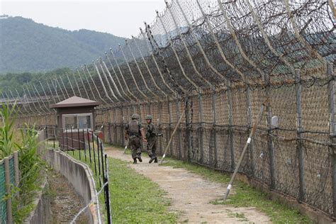 North Korean gymnast vaults 12ft barbed wire fence and sprints to freedom across world's most ...