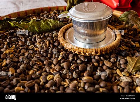 Vietnam coffee filter and beans Stock Photo - Alamy