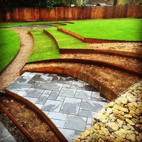 Terracing and shifting soil in a sloped garden to create more usable spaces - sneaking a couple ...