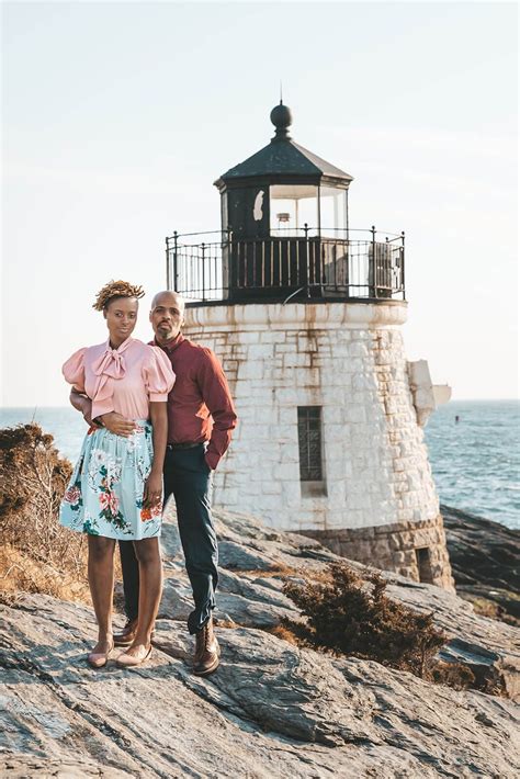 Couple embrace in front of Castle Hill Lighthouse in Newport, RI in celebration of their 10 year ...