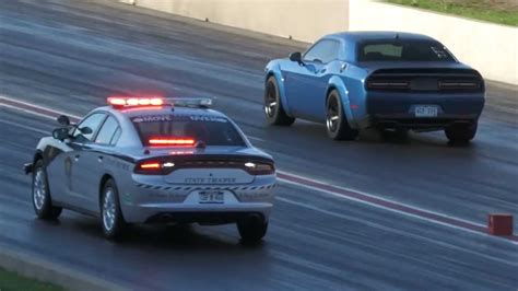 Two Dodge Challenger Hellcats Outrun Police Charger At Drag Strip