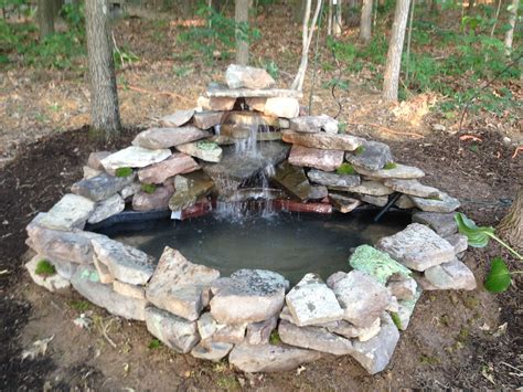 a 125 gallon pre-form pond with 800 gallon per hour pump creating a waterfall. Situated next to ...