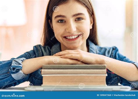 Close Up of Teenage Girl Resting Hands on Books Stock Photo - Image of gadget, girl: 109047368