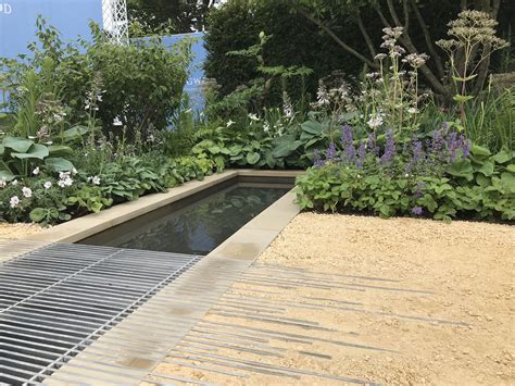 Water rill with metal detail surrounding by Goldpath Self-Binding Gravel Garden Works, Garden ...