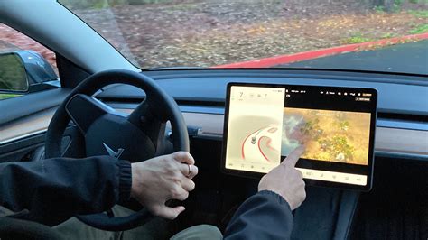 Tesla is under investigation over the potential for drivers to play ...