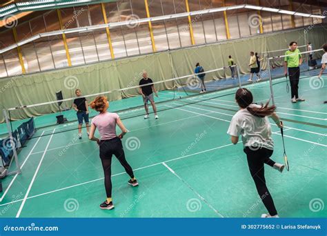 Indoor Sports. People Different Ages Play Badminton on Sports Court Indoors Editorial ...