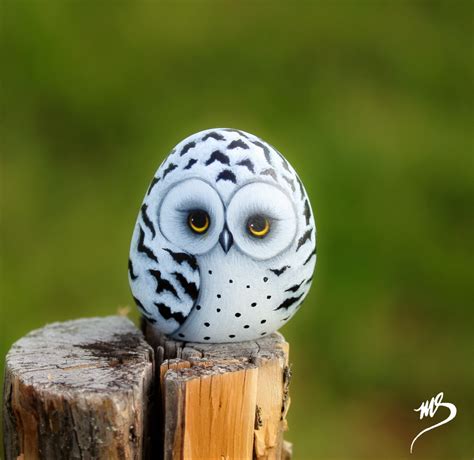 This adorable "Snowy Owl" is hand painted on a beach rock. He is perched on a tree stump. Made ...