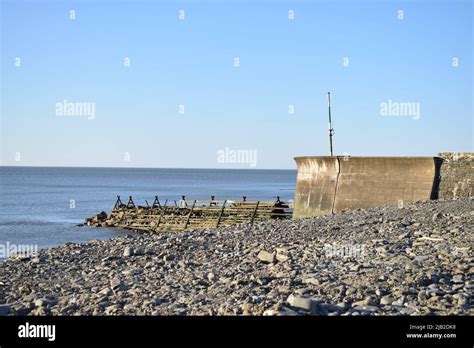 Harbour wall at Aberaeron beach, Wales, UK Stock Photo - Alamy