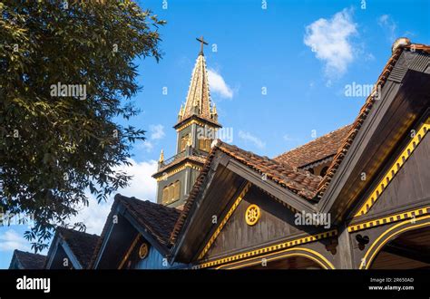 The spire rises over the famed wooden church, or the Catholic Kontum Cathedral, in the city of ...