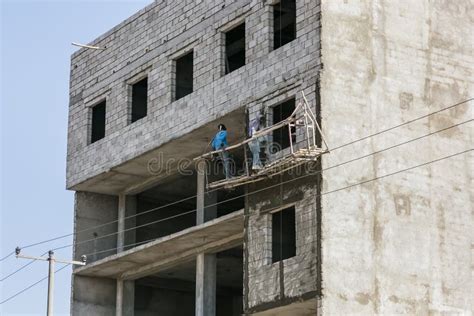 Construction Workers on a Hanging Scaffold Editorial Photo - Image of labourers, world: 119689461