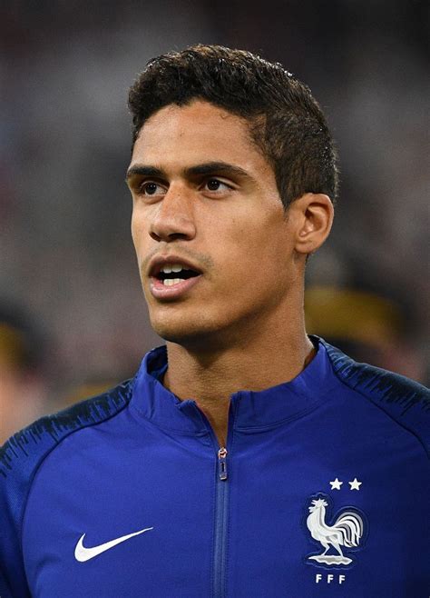 France's defender Raphael Varane listens to his national anthem ahead ...