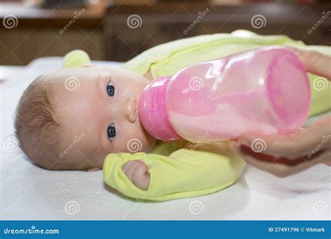 Newborn Baby Girl with a Bottle of Milk. Stock Photo - Image of adorable, girl: 27491796