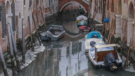 Venice's famed canals run dry as city grapples with climate change