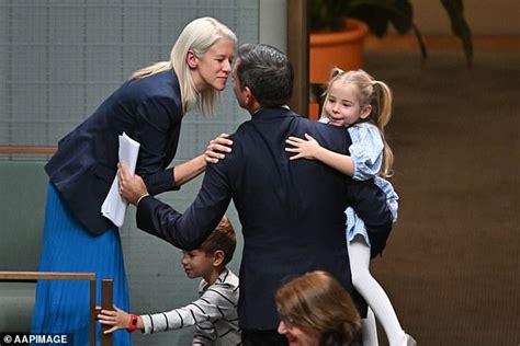 Jim Chalmers' wife Laura and Jodie Haydon cheer as Treasurer hugs his ...