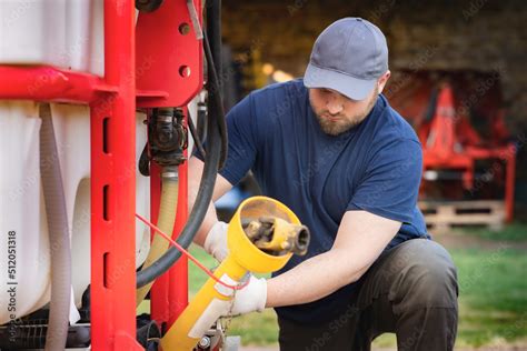 The farmer repairs agricultural machines Stock Photo | Adobe Stock