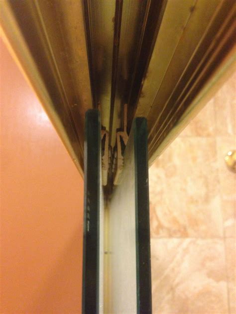 How can I stop my shower doors from hitting one another and making an awful noise? - Home ...