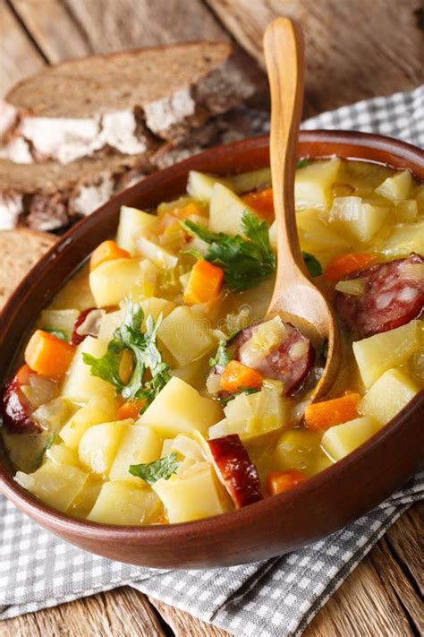 German Potato Vegetable Soup with Sausages Served with Bread Close-up. Vertical Stock Image ...