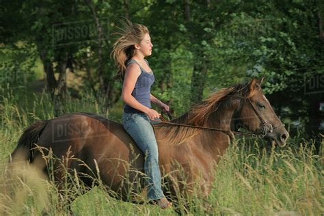 Girl Riding A Horse Bareback; Troutdale, Oregon, United States of America - Stock Photo - Dissolve