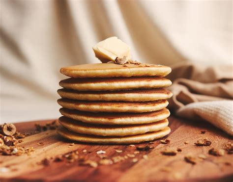 Free Photo | Closeup shot of delicious pancakes with butter, figs, and roasted nuts on a wooden ...