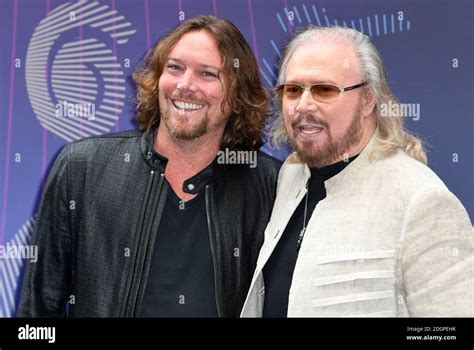 Barry Gibb (right) and son Ashley Gibb arriving for the Nordoff Robbins O2 Silver Clef Awards ...