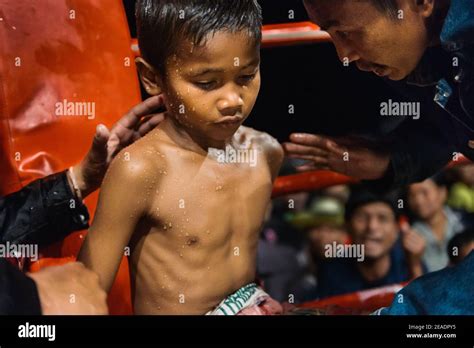 Muay Thai child fighter between rounds in a fight Stock Photo - Alamy