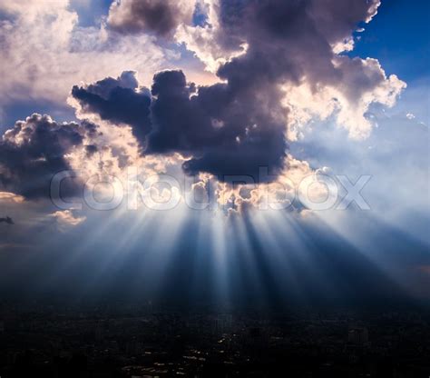 Rays of light shining through dark ... | Stock image | Colourbox