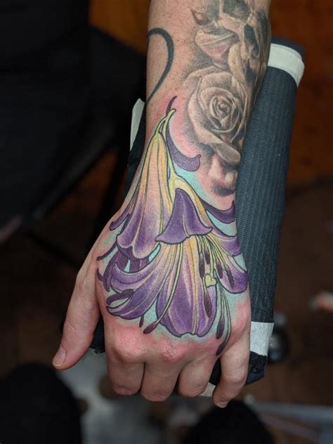 Color flower hand tattoo by Kaija Heitland: TattooNOW