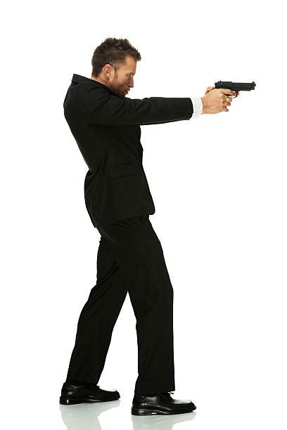 Man Pointing Gun Suit Full Body Pictures, Images and Stock Photos - iStock