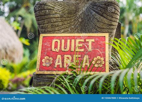 A Sign QUIET AREA in a Quiet Corner of the Garden Stock Photo - Image ...