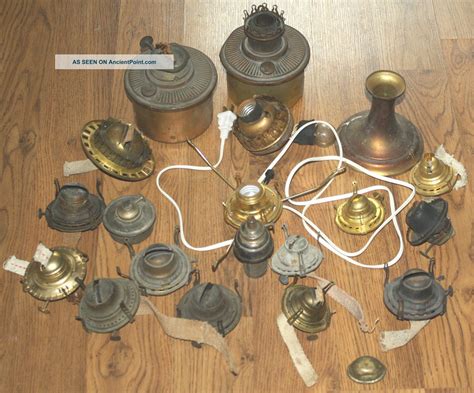 an assortment of antique brass items on a wooden floor