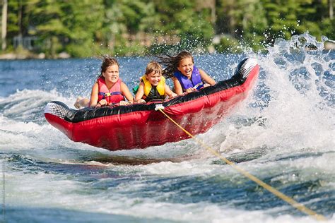 "Family Lifestyle Together Tubing On Lake In New Hampshire Behind Boat ...