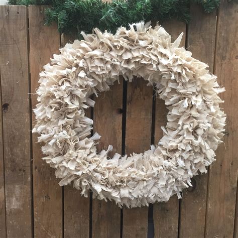 Beautiful, simple rag wreath made with Osnaburg homespun fabric and tobacco cloth strips from ...