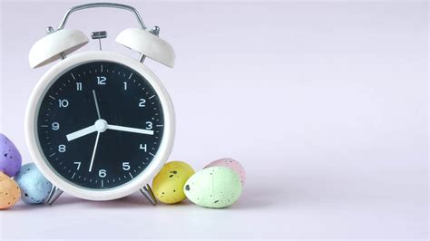 A clock with colorful easter eaggs 14142374 Stock Video at Vecteezy