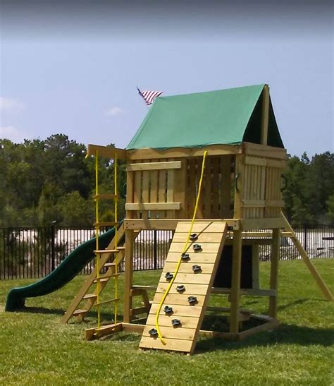 Summit Swing Set: 10 ft Wave Slide, Rock Climbing Wall, 2 Ladders, 2 B ...