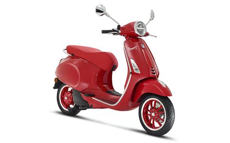 Vespa Elettrica, a modern technological icon, is dressed entirely in ...