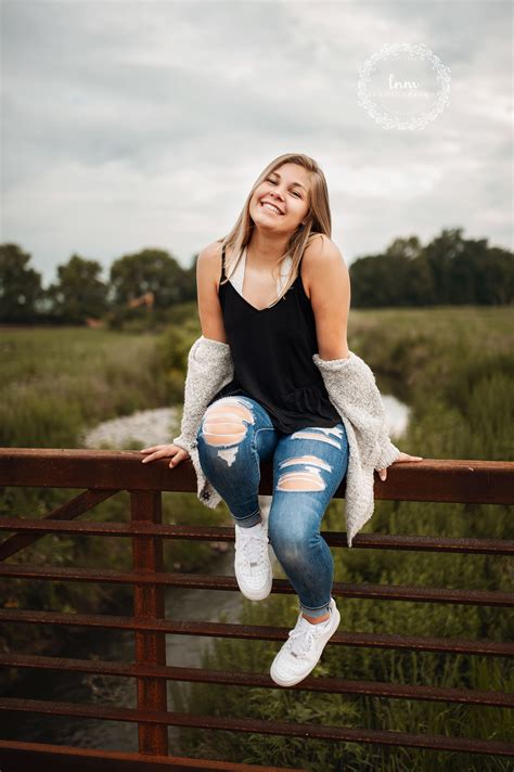 Unique senior girl poses - candid - flowers - nature - outdoors - sitting - arm poses - movement ...