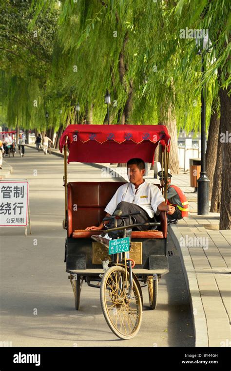 Rickshaw china driver hi-res stock photography and images - Alamy