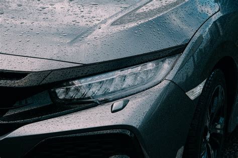 Rain on the Headlight and Hood of a Car · Free Stock Photo