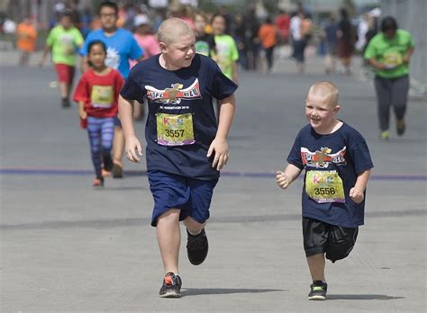 Photos: More than 8,400 participate in kids run as prelude to OC Marathon – Orange County Register