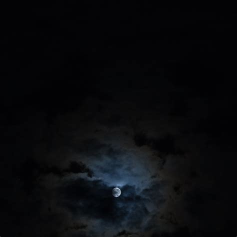 Premium Photo | Full moon in the clouds in the night sky