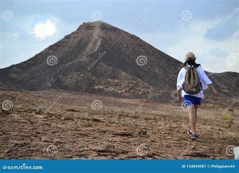 Hiking Towards Mountain at Bottom of Makhtesh Ramon Crater, Mitzpe Ramon, Negev Desert, Israel ...