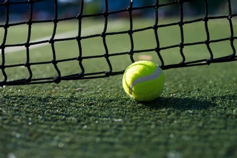 Close-up tennis ball on the ground Photo | Free Download