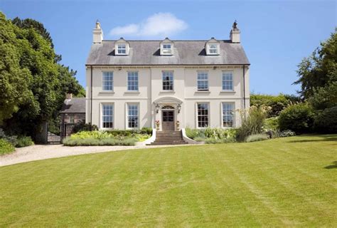 Classical Neo-Georgian country house with stone coach house, courtyard ...